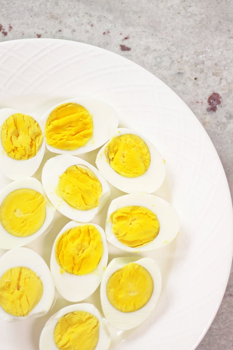 instant pot hard boiled eggs sliced on a white plate