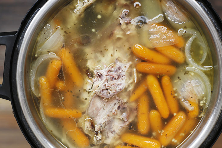 easy homemade instant pot chicken stock in the instant pot with carrots and onions