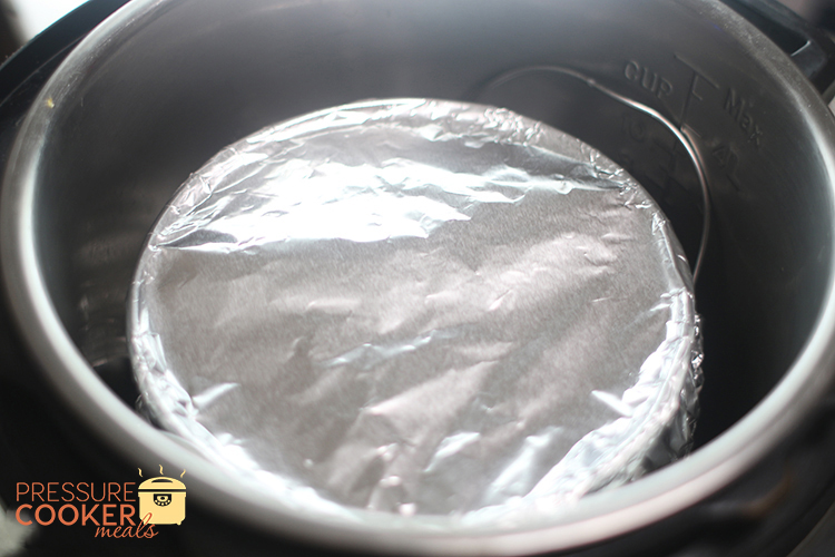 Instant Pot Chocolate Chip Cookie Dough Cheesecake wrapped in foil before baking