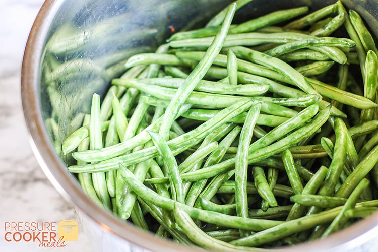 fresh green beans in the Instant Pot pot on the counter