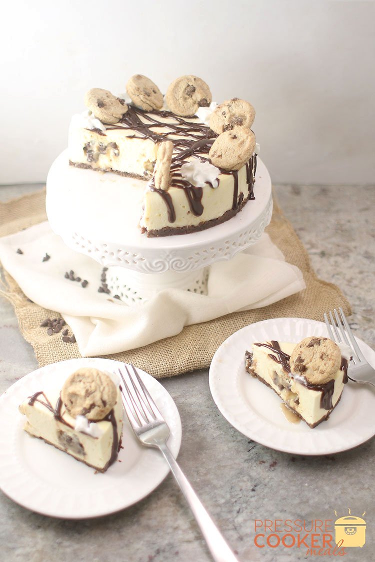 slices of Instant Pot Chocolate Chip Cookie Dough Cheesecake on plates with forks