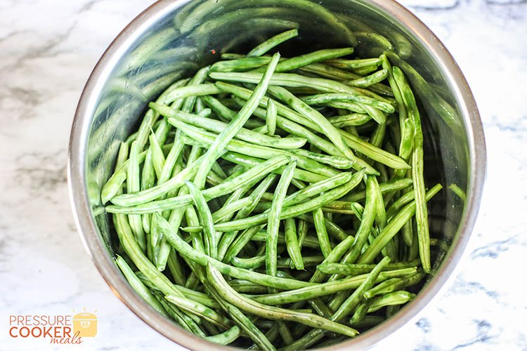 fresh green beans in the Instant Pot pot on the counter
